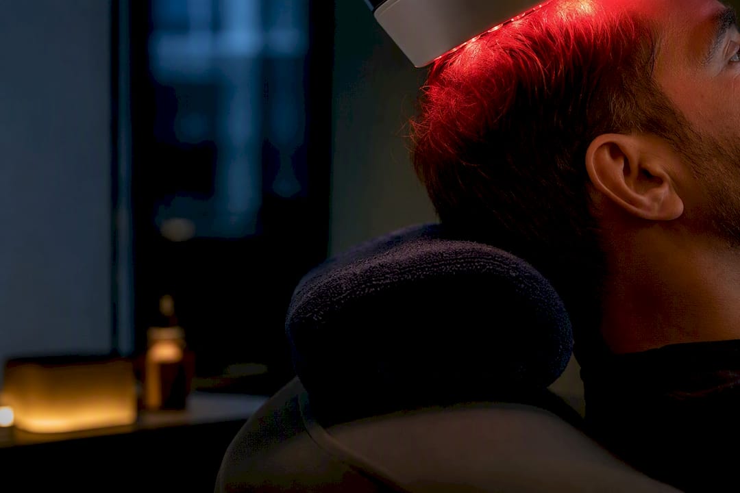 Person receiving low-level light therapy
